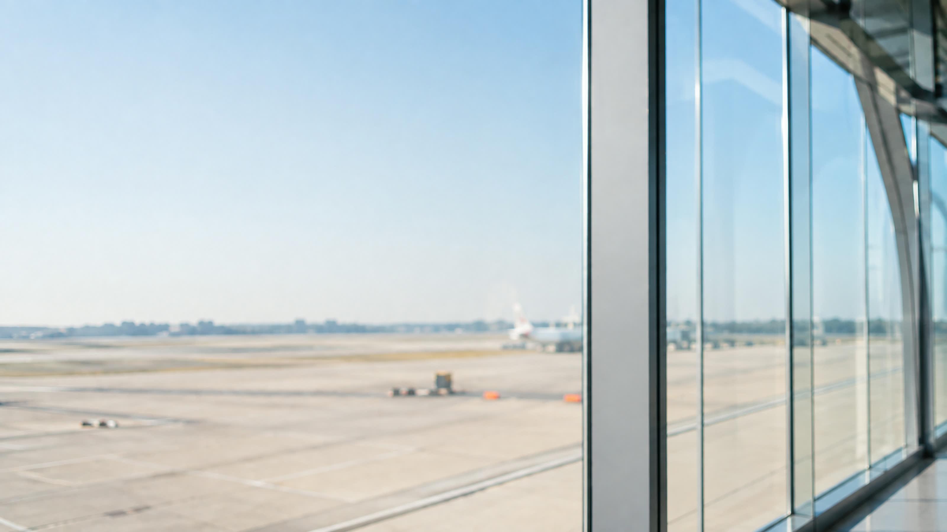Airport window looking out onto the runway